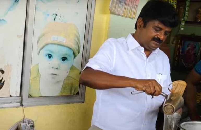 Former minister Vijayabaskar making tea at tea stall